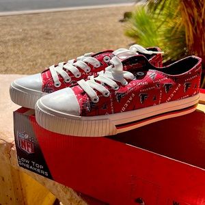Never worn size 6 womens low top sneakers NFL Falcons logo